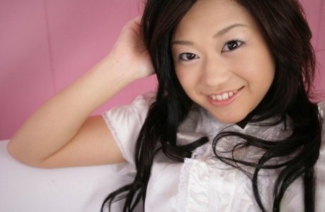 10558035_015_b5dd Cute Japanese model Minako Oyama poses non nude in a blouse and skirt