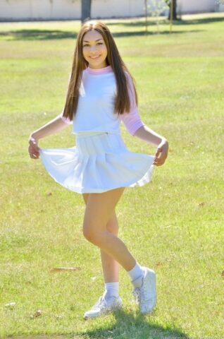 15563573_049_1df2-1 Brunette cutie Kelly reveals her tiny tits and fingers her snatch in the park