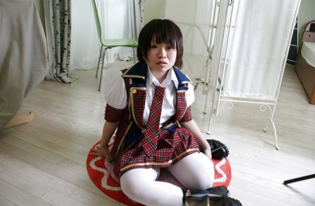15892688_002_1ee1 Asian schoolgirl Mayu Nakane revealing her nice ass and inviting gash