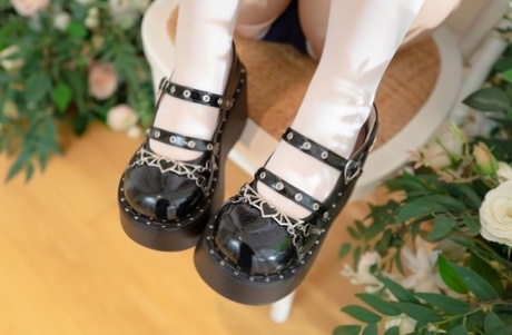 17374391_009_4219 Adorable Japanese girl removes her shoes while wearing white stockings