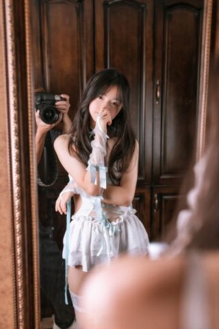 18770276_009_4e0a Petite Asian girl doffs a blindfold while wearing sensual lingerie and hosiery