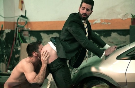 Gay businessman Dani Robles enjoys anal sex with a hung carwash guy