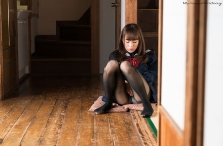 29413556_002_8c59 Young Asian schoolgirl pulling down her black pantyhose to masturbate