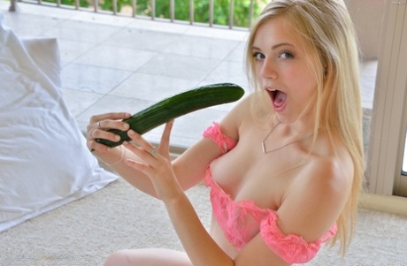 34382899_012_a34e Petite blonde bimbo slides a banana and a cucumber in her tight muff