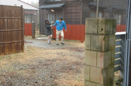 44328106_002_3566 Asian honey Mai Shimizu kneels in front of a guy and gives head outdoors
