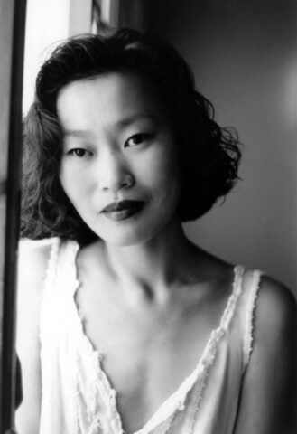 Asian babe shows her petite body & her tiny tits in a black & white scene