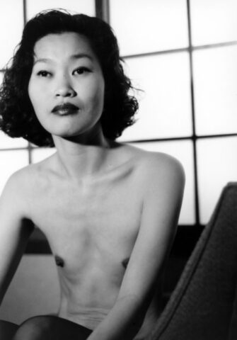Asian babe shows her petite body & her tiny tits in a black & white scene