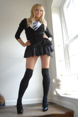 47913247_001_23a3 Adorable babe in black socks Elle Parker taking off her school uniform