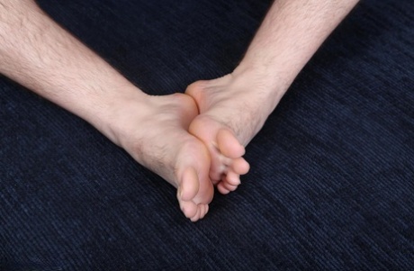 Good-looking gay Ethan shows off his athletic naked body and his hairy cock