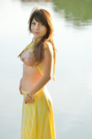 49154612_047_757c Stunner Stacey masturbating in public in her elegant yellow dress