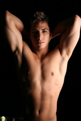 Kinky gay Topher loses his clothes and fondles his stiff boner on a bed