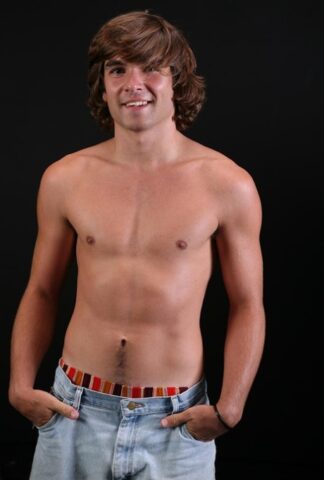 Long haired gay dude Dane shows his big dick and hot bum on a bed