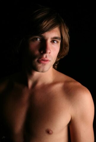 Long haired gay dude Dane shows his big dick and hot bum on a bed