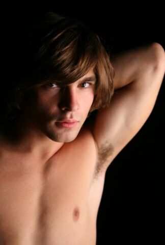 Long haired gay dude Dane shows his big dick and hot bum on a bed
