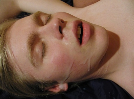 Blonde twink takes a facial after giving a hot blowjob outdoors