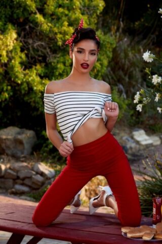 59626469_021_9f5a Dark-haired babe Emily Willis poses naked while eating a watermelon outdoors
