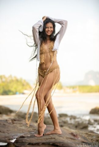 60893335_003_1e8b Hot Thai teen Bua loses her bikini to go nude next to the water