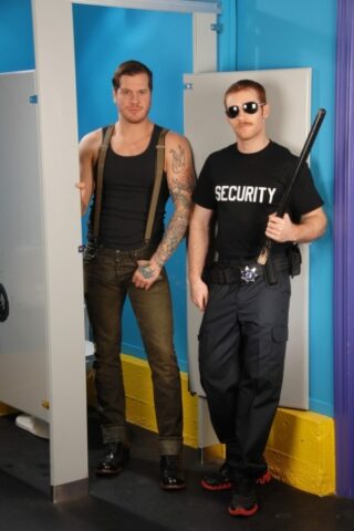 Muscular stud James Jamesson having anal sex with a gay officer in the toilet