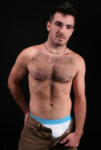 Hairy gay bear Colton shows off his hairy chest and dick before jerking