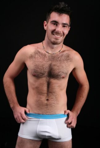 Hairy gay bear Colton shows off his hairy chest and dick before jerking