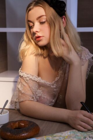 66615298_009_35a5 Blonde beauty Daniel Sea shows her splendid tits and poses nude on a chair