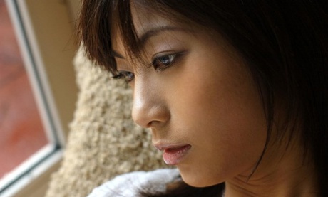 67938688_007_5bf7 Beautiful Japanese girl Rin Suzuka lets a firm breast loose during solo action