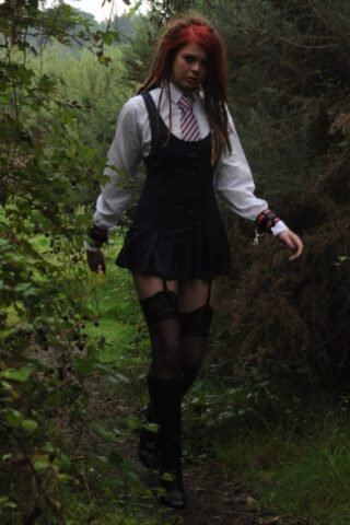 69801167_008_45b5 Tall schoolgirl shows off her hot legs in stockings and boots outdoors