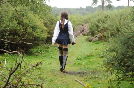 69801167_012_3fe2 Tall schoolgirl shows off her hot legs in stockings and boots outdoors