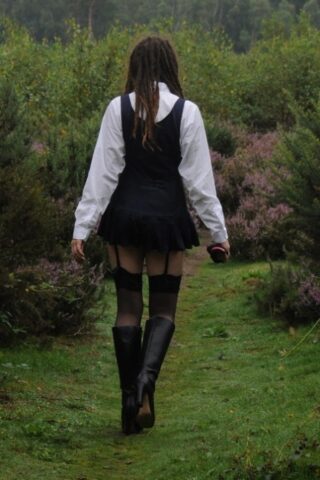 69801167_013_3c65 Tall schoolgirl shows off her hot legs in stockings and boots outdoors