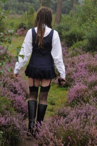 69801167_014_74c2 Tall schoolgirl shows off her hot legs in stockings and boots outdoors