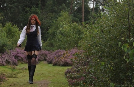 69801167_016_f3c2 Tall schoolgirl shows off her hot legs in stockings and boots outdoors