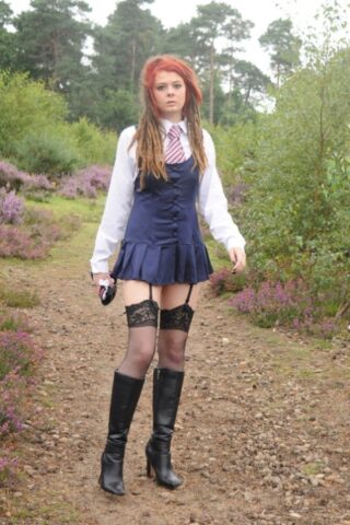 69801167_021_a965 Tall schoolgirl shows off her hot legs in stockings and boots outdoors