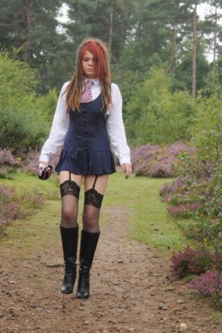 69801167_022_02ee Tall schoolgirl shows off her hot legs in stockings and boots outdoors