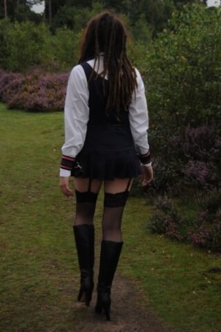 69801167_023_2a1b Tall schoolgirl shows off her hot legs in stockings and boots outdoors
