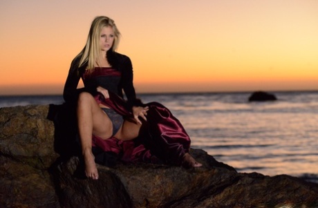 70745144_002_1a5e Blonde babe Scarlet Red goes topless during a sexy striptease at the beach