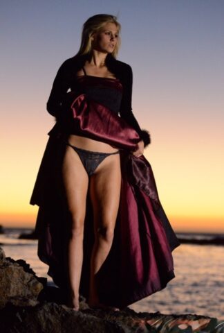 70745144_008_3a35 Blonde babe Scarlet Red goes topless during a sexy striptease at the beach