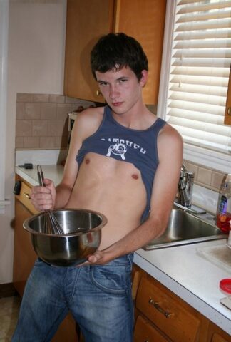 73960795_010_2608 Naughty gay Devin Moss strips naked & jerks his big dick while baking