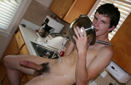 73960795_065_c9ab Naughty gay Devin Moss strips naked & jerks his big dick while baking