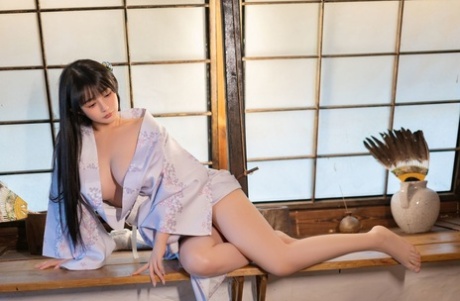 Petite Asian girl posing in her lovely outfit and unveiling her boobs