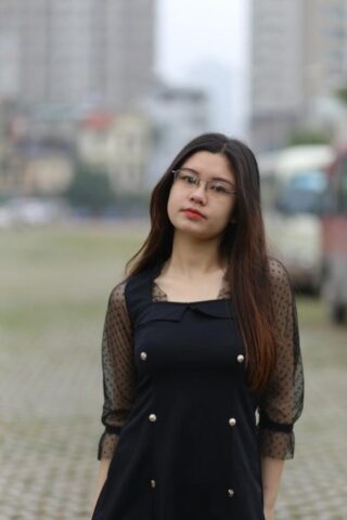 Pretty Asian model Natalia posing in her lovely black outfit outdoors