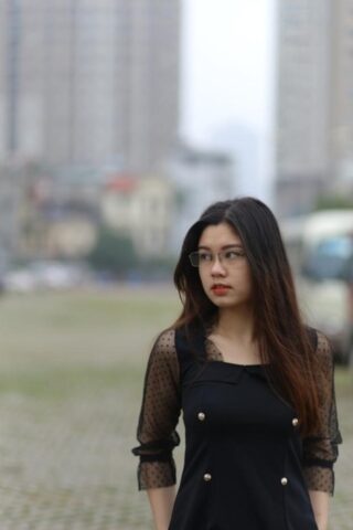 Pretty Asian model Natalia posing in her lovely black outfit outdoors