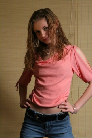 77364103_003_db21 Skinny babe Lil Candy shows her tiny boobs while posing in her winter jacket