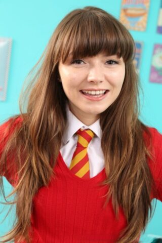 Adorable brunette teen Helen G strips to yellow nylons and poses topless