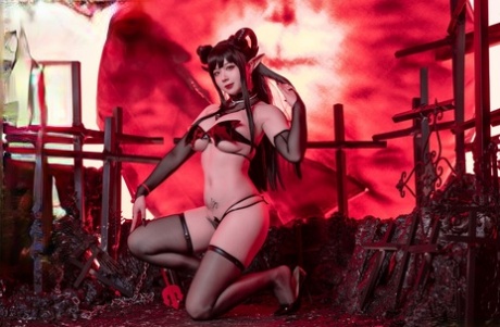 Adorable Asian girl models sexy lingerie in arm socks and hosiery