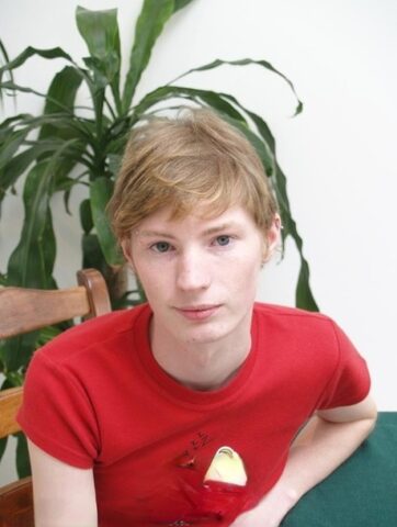 Blue eyed ginger twink Jackson C strips naked and jerks off his boner