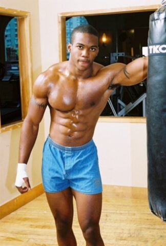 Black gay with hot muscles Houston A exposes his big prick after a gym workout