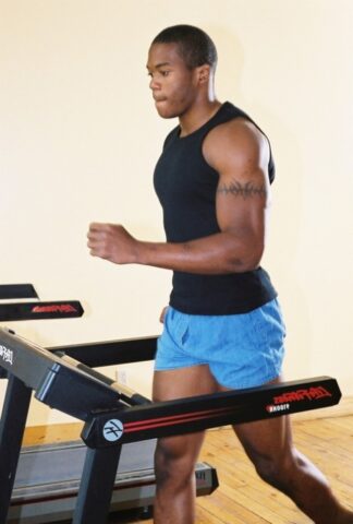 Black gay with hot muscles Houston A exposes his big prick after a gym workout