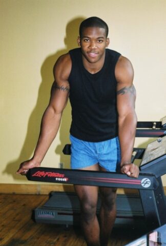 Black gay with hot muscles Houston A exposes his big prick after a gym workout