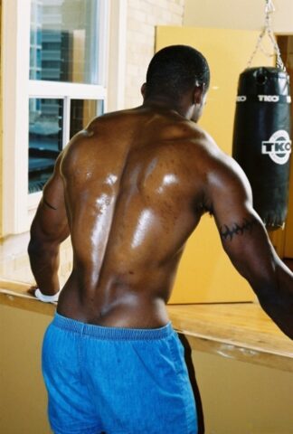 Black gay with hot muscles Houston A exposes his big prick after a gym workout