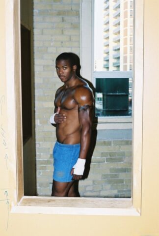 Black gay with hot muscles Houston A exposes his big prick after a gym workout